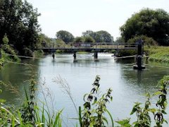 The River Thames heading away to Duxford at Shifford Cut, England.